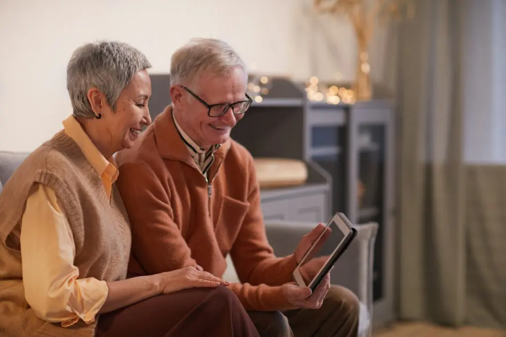 elderly couple sitting on couch
