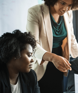 two female professionals talking