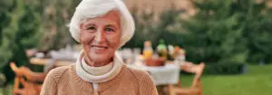 Elderly woman outside in yard