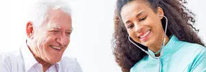 Nurse speaking to senior man