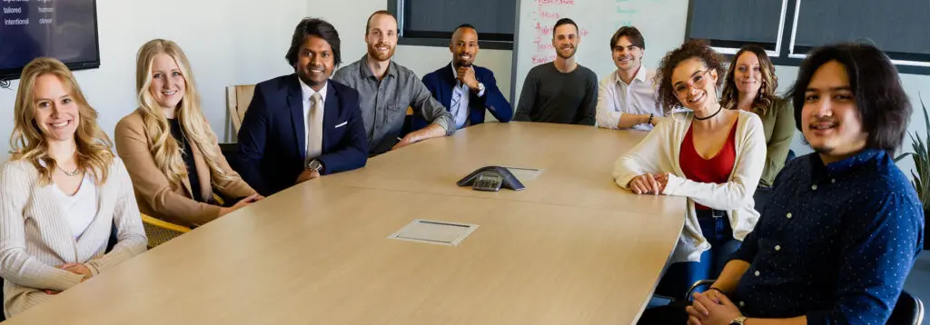 Diverse group of professionals around conference table