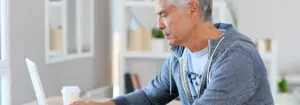 Man sitting at laptop