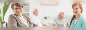 Group of elderly individuals and a female nurse