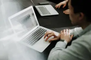 Man typing on laptop