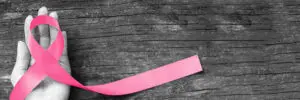 a hand holding a ribbon