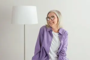woman smiling wearing glasses