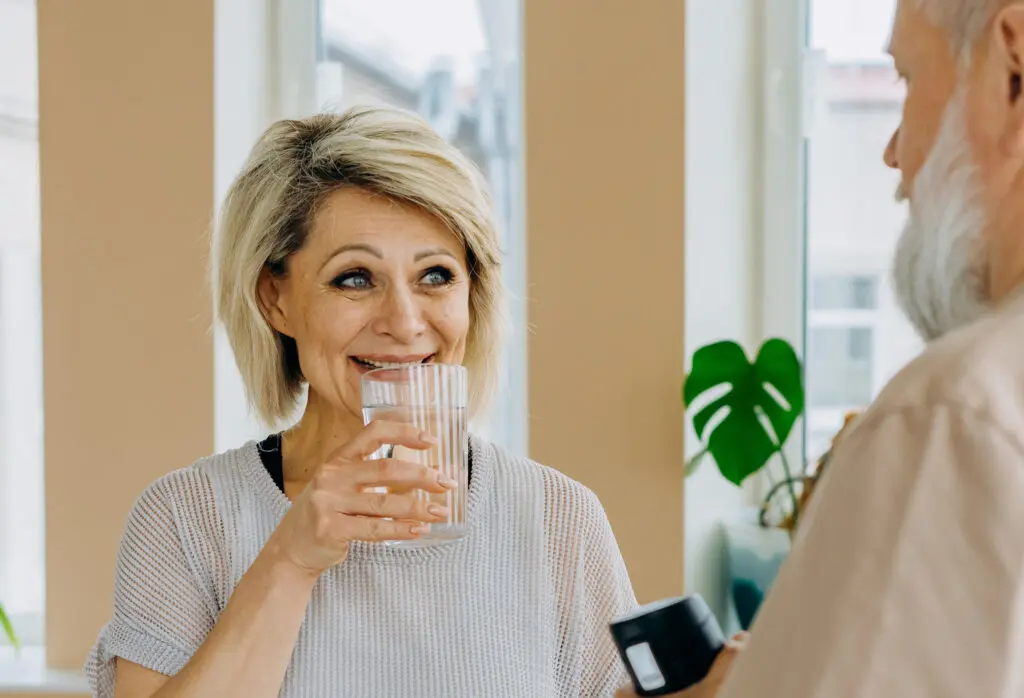 Elderly Woman Drinking a Glass of Water