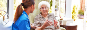 Senior woman speaking to nurse