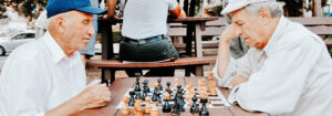Two elderly men playing chess