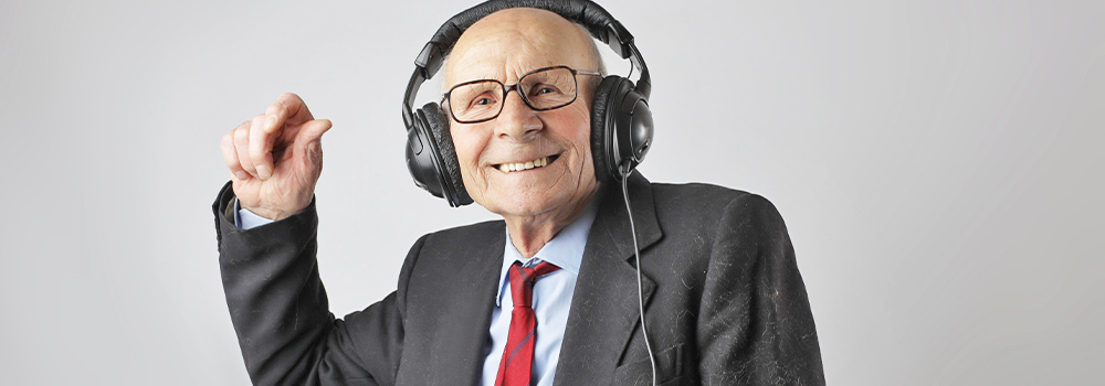 Senior man with headphones on