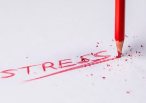 the words stress written in red colored pencil