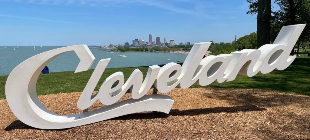 Cleveland tourism sign with the city skyline in the background