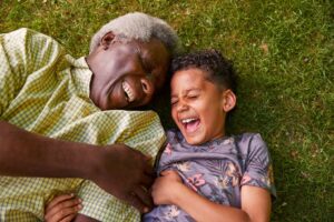Grandfather-and-grandson-on-the-grass-300x200 | McGregor PACE